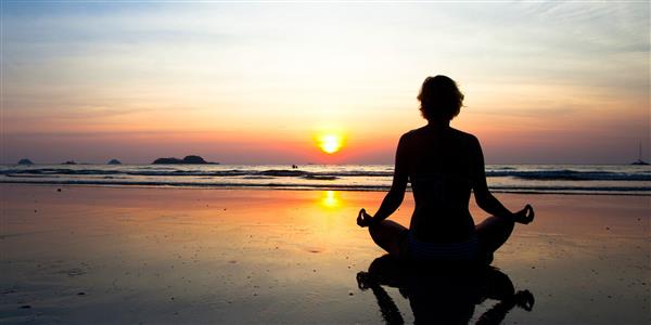 Meditation at sunset on a beach